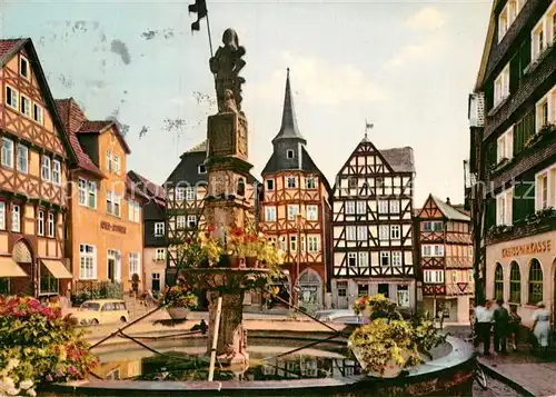 AK / Ansichtskarte Fritzlar Marktplatz mit Rolandsbrunnen Fachwerkhaeuser Altstadt Kat. Fritzlar