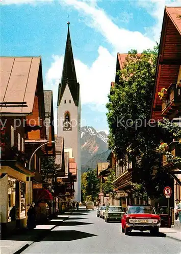 AK / Ansichtskarte Oberstdorf Kirchstrasse mit Kirche Kat. Oberstdorf