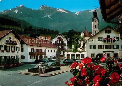 AK / Ansichtskarte Bad Kohlgrub Ortsmotiv mit Brunnen und Kirche Kat. Bad Kohlgrub