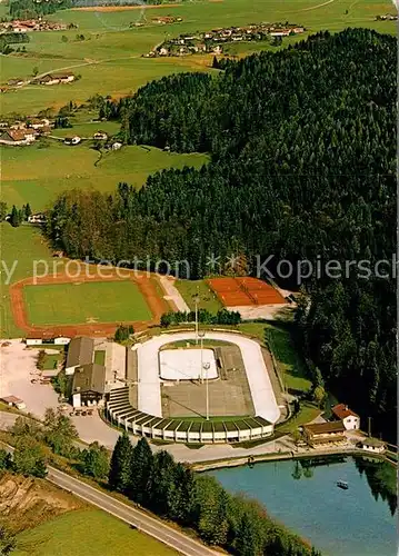 AK / Ansichtskarte Inzell Eisstadion mit Sportplatz und Tennisanlage Fliegeraufnahme Kat. Inzell