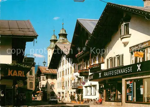 AK / Ansichtskarte St Johann Tirol Speckbacherstrasse Raiffeisenkasse Friseur Salon Figaro  Kat. St. Johann in Tirol