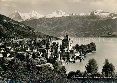 AK / Ansichtskarte Oberhofen Thunersee mit Eiger Moench und Jungfrau Kat. Oberhofen Thunersee