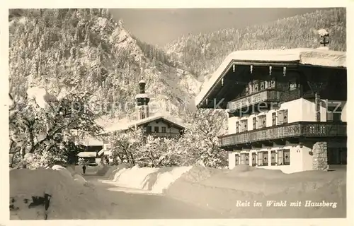 AK / Ansichtskarte Reit Winkl Ortspartie an der Kirche im Winter mit Hausberg Kat. Reit im Winkl