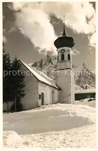 AK / Ansichtskarte Schruns Vorarlberg verschneites Dorf mit Kirche Kat. Schruns