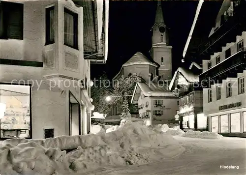 AK / Ansichtskarte Hindelang Winter Dorfstrasse Nachtaufnahme Kat. Bad Hindelang