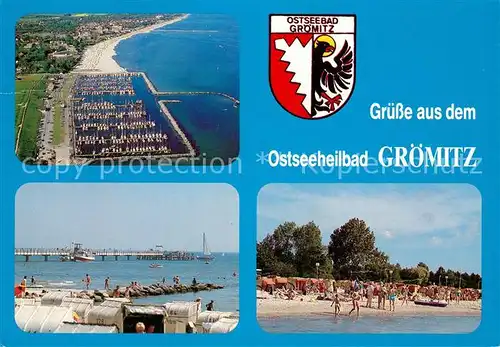 AK / Ansichtskarte Groemitz Ostseebad Fliegeraufnahme Strand Seebruecke Kat. Groemitz