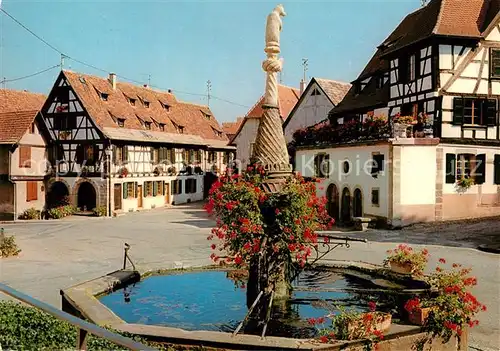 AK / Ansichtskarte Dambach la Ville Place du Marche Fontaine fleurie vieilles maisons alsaciennes Kat. Dambach la Ville