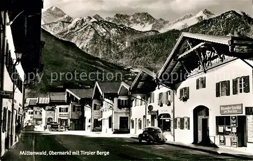 AK / Ansichtskarte Mittenwald Karwendel Tirol Obermarkt mit Tiroler Berge Kat. Schwaz