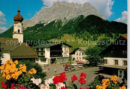 AK / Ansichtskarte Ehrwald Tirol Ortsmotiv mit Kirche Blick zur Zugspitze Wettersteingebirge