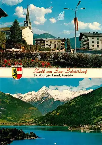 AK / Ansichtskarte Schuettdorf Zell Strassenpartie Blick ueber den See zum Kitzsteinhorn Hohe Tauern Kat. Zell am See