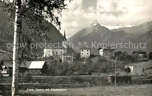 AK / Ansichtskarte Kaprun Ortsansicht mit Kirche Blick zum Kitzsteinhorn Hohe Tauern Kat. Kaprun