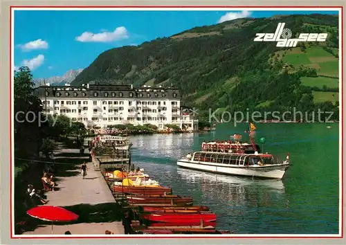 AK / Ansichtskarte Zell See Uferpromenade mit Grand Hotel Kat. Zell am See