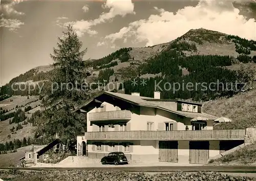 AK / Ansichtskarte Mittelberg Kleinwalsertal Haus Fruehwirt mit Kurgehrenspitze Kat. Oesterreich