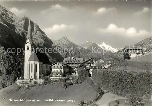 AK / Ansichtskarte Heiligenblut Kaernten Ortsansicht mit Kirche Grossglockner Hohe Tauern Kat. Heiligenblut