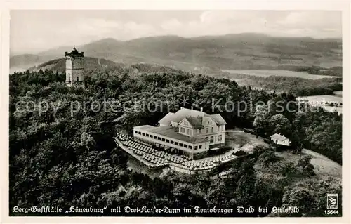 AK / Ansichtskarte Teutoburgerwald Berggaststaette Huenenburg mit Drei Kaiser Turm Fliegeraufnahme Kat. Detmold