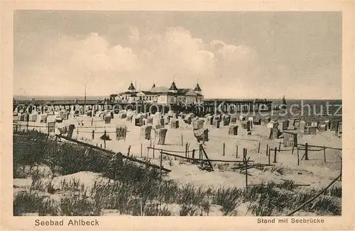 AK / Ansichtskarte Ahlbeck Ostseebad Strand mit Seebruecke Kat. Heringsdorf Insel Usedom