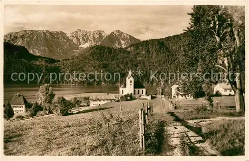 AK / Ansichtskarte Weissensee Fuessen Ortsmotiv mit Kirche mit Schlicke Tannheimer Berge Faldro Karte Kat. Fuessen