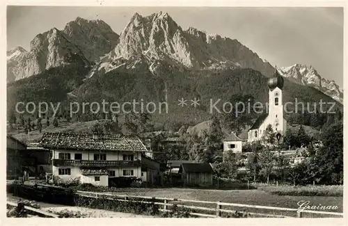 AK / Ansichtskarte Grainau Ortsansicht mit Kirche gegen Waxenstein Riffelwaende Zugspitze Wettersteingebirge Kat. Grainau