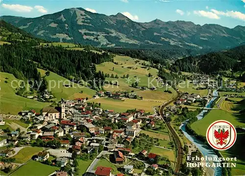 AK / Ansichtskarte Hopfgarten Brixental Fliegeraufnahme mit Pfarrkirche und Sessellift Hohe Salve Kat. Hopfgarten im Brixental