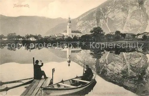 AK / Ansichtskarte Nassereith Bootssteg Angler Wasserspiegelung Kirche Alpen Kat. Nassereith