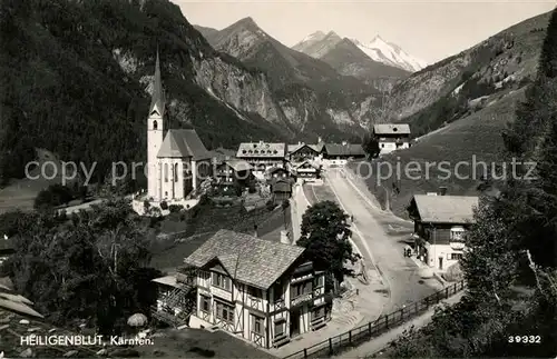 AK / Ansichtskarte Heiligenblut Kaernten Ortsansicht mit Kirche Blick zum Grossglockner Hohe Tauern Kat. Heiligenblut