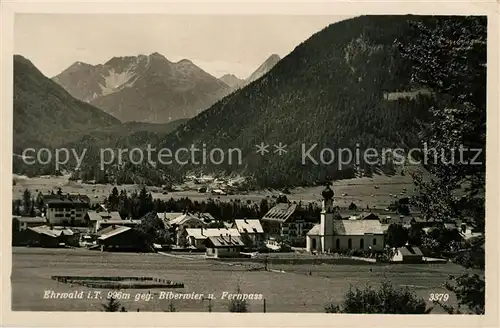 AK / Ansichtskarte Ehrwald Tirol Ortsansicht mit Kirche gegen Biberwier und Fernpass Alpen