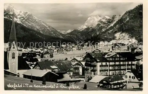 AK / Ansichtskarte Seefeld Tirol Ortsansicht mit Kirche Karwendelgebirge Arnspitzen Kat. Seefeld in Tirol