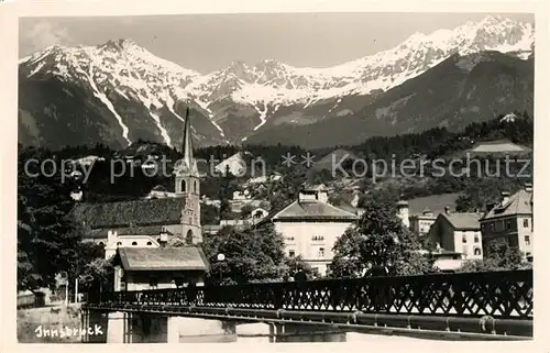 AK / Ansichtskarte Innsbruck Ortsmotiv mit Bruecke und Kirche Alpen Kat. Innsbruck