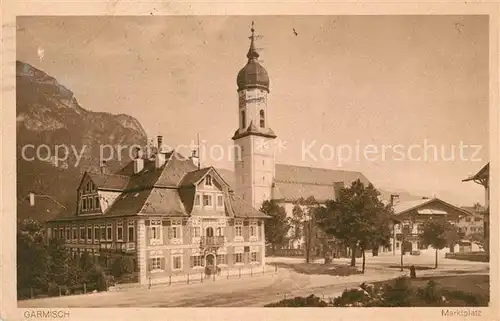 AK / Ansichtskarte Garmisch Partenkirchen Ortsmotiv mit Kirche Kat. Garmisch Partenkirchen
