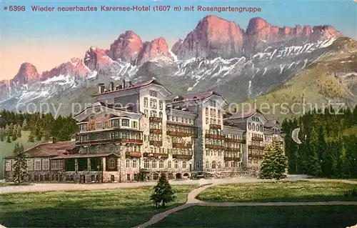 AK / Ansichtskarte Karersee Suedtirol Wieder neuerbautes Karersee Hotel mit Rosengartengruppe Dolomiten Kat. Welschnofen