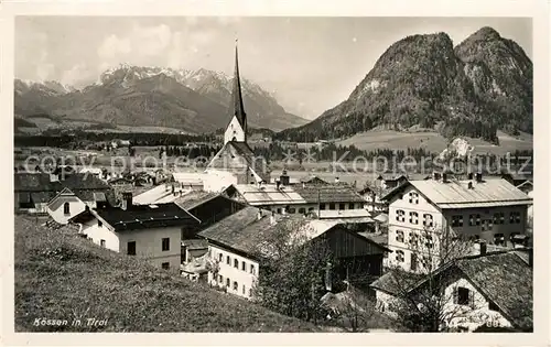 AK / Ansichtskarte Koessen Tirol Ortsansicht mit Kirche Alpenpanorama Kat. Koessen