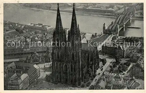 AK / Ansichtskarte Koeln Rhein Fliegeraufnahme mit Hauptbahnhof Dom Hohenzollernbruecke und Ausstellungsgelaende Kat. Koeln