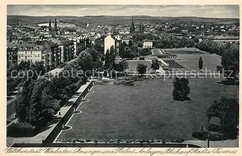 AK / Ansichtskarte Wiesbaden Reisinger und Herbert Anlagen Stadtblick mit Taunus Kat. Wiesbaden