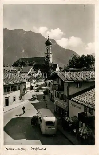 AK / Ansichtskarte Oberammergau Dorfstrasse mit Kirche Kat. Oberammergau