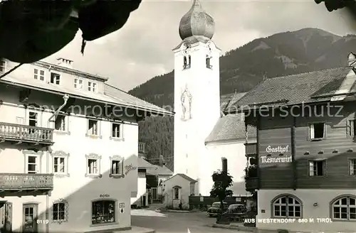 AK / Ansichtskarte Westendorf Tirol Dorfmotiv mit Kirche Gasthof Mesnerwirt Kat. Westendorf