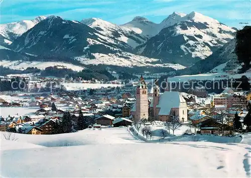 AK / Ansichtskarte Kitzbuehel Tirol Kirche Winterpanorama Kat. Kitzbuehel