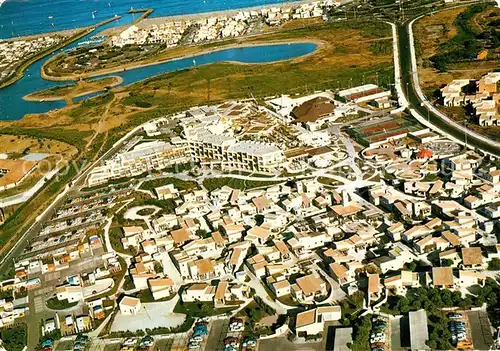 AK / Ansichtskarte Cap d Agde Quartier des villages de vacances au fond Port Nature vue aerienne Kat. Agde
