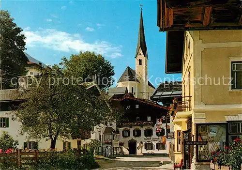 AK / Ansichtskarte Kirchberg Tirol Ortspartie mit Kirche Kat. Kirchberg in Tirol