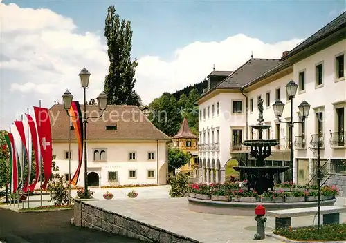 Millstatt Millstaettersee Rathaus mit Kurhaus Kongresshaus Brunnen Fahnen Kat. Millstatt Millstaetter See