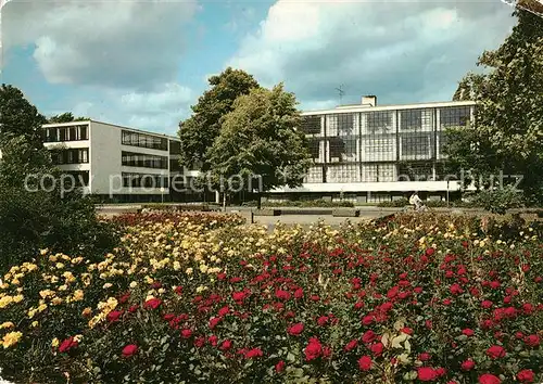 AK / Ansichtskarte Dessau Rosslau Bauhaus mit Bauhausplatz Blumenbeet Kat. Dessau Rosslau