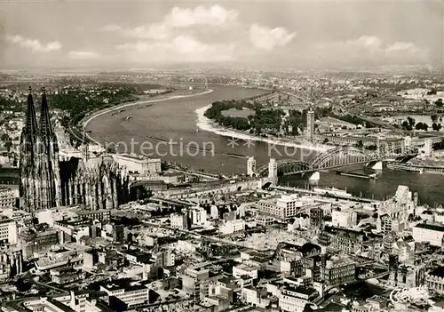 AK / Ansichtskarte Koeln Rhein Stadtbild mit Dom Rheinbruecke Fliegeraufnahme Kat. Koeln