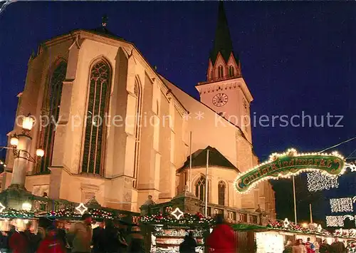 AK / Ansichtskarte Villach_Kaernten Stadtpfarrkirche Weihnachtsmarkt am Abend Villach_Kaernten Kat. Villach