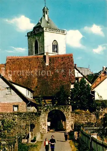 AK / Ansichtskarte Neukirchen_Knuellgebirge Altes Stadttor mit Kirche Neukirchen Knuellgebirge