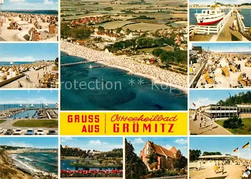 AK / Ansichtskarte Groemitz_Ostseebad Strand Promenade Hafen Seebruecke Fliegeraufnahme Groemitz_Ostseebad