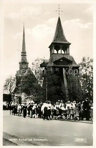 AK / Ansichtskarte Mora_Schweden Kyrkan och Klockstapeln Mora Schweden