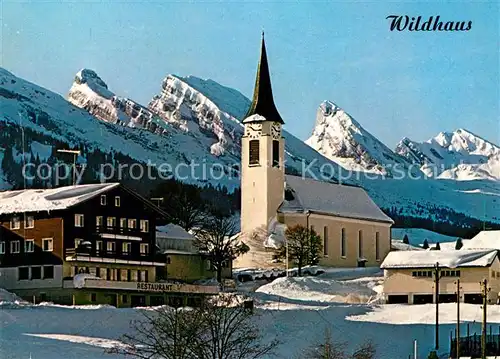 AK / Ansichtskarte Wildhaus_SG Kath Kirche mit Churfirsten Wildhaus SG