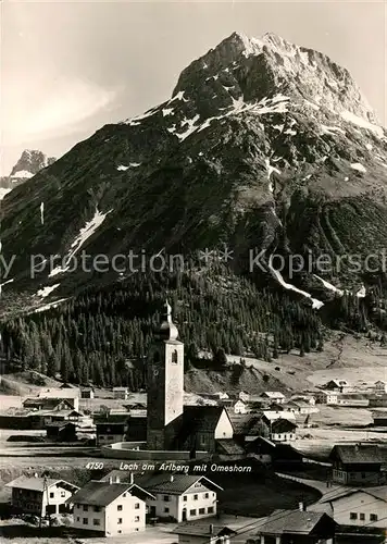 AK / Ansichtskarte Lech_Vorarlberg Ortsansicht mit Kirche Blick zum Omeshorn Lechtaler Alpen Lech Vorarlberg