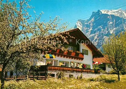 AK / Ansichtskarte Ehrwald_Tirol Gaestehaus Jaegerheim Baumbluete Wettersteingebirge Ehrwald Tirol
