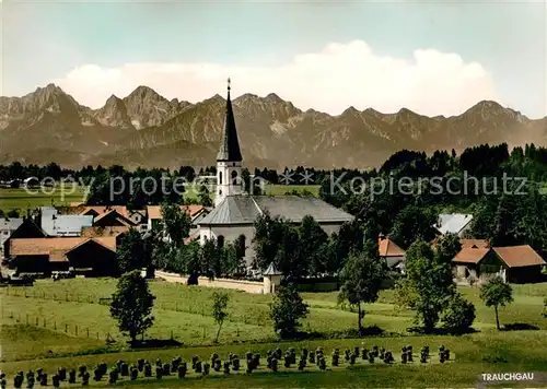 AK / Ansichtskarte Trauchgau Ortsmotiv mit Kirche Tiroler und Allgaeuer Hochgebirge Trauchgau
