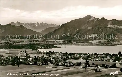 AK / Ansichtskarte Chieming_Chiemsee Fliegeraufnahme mit Kaisergebirge Chieming Chiemsee